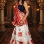 Cream & Red Shimmer Lehenga with Ganesha Embroidery and Banarasi Zari Dupatta