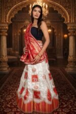 Cream & Red Shimmer Lehenga with Ganesha Embroidery and Banarasi Zari Dupatta